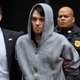 Martin Shkreli, the former hedge fund manager under fire for buying a pharmaceutical company and ratcheting up the price of a life-saving drug, is escorted by law enforcement agents in New York, after being taken into custody following a securities probe.